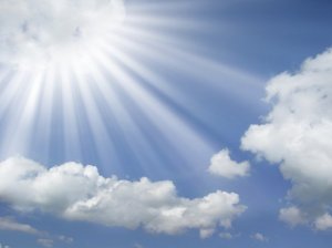 sun-rays-coming-out-of-the-clouds-in-a-blue-sky-wallpaper1